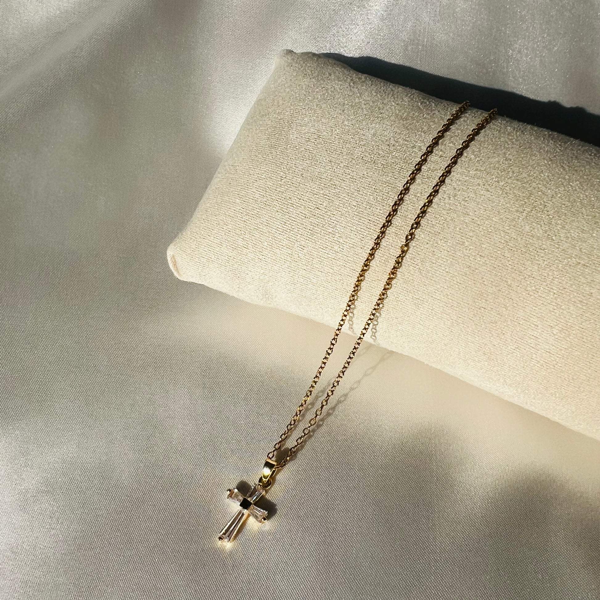 Gold necklace with a cross pendant